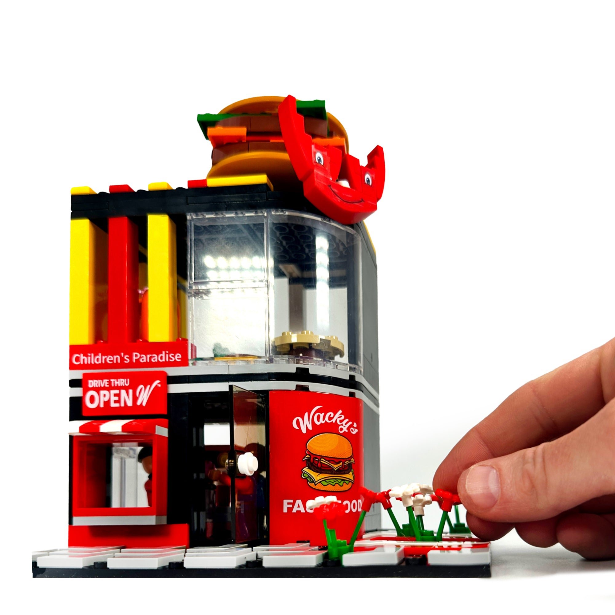Wacky's Fast Food™ Burger Joint shown with hand for scale perspective