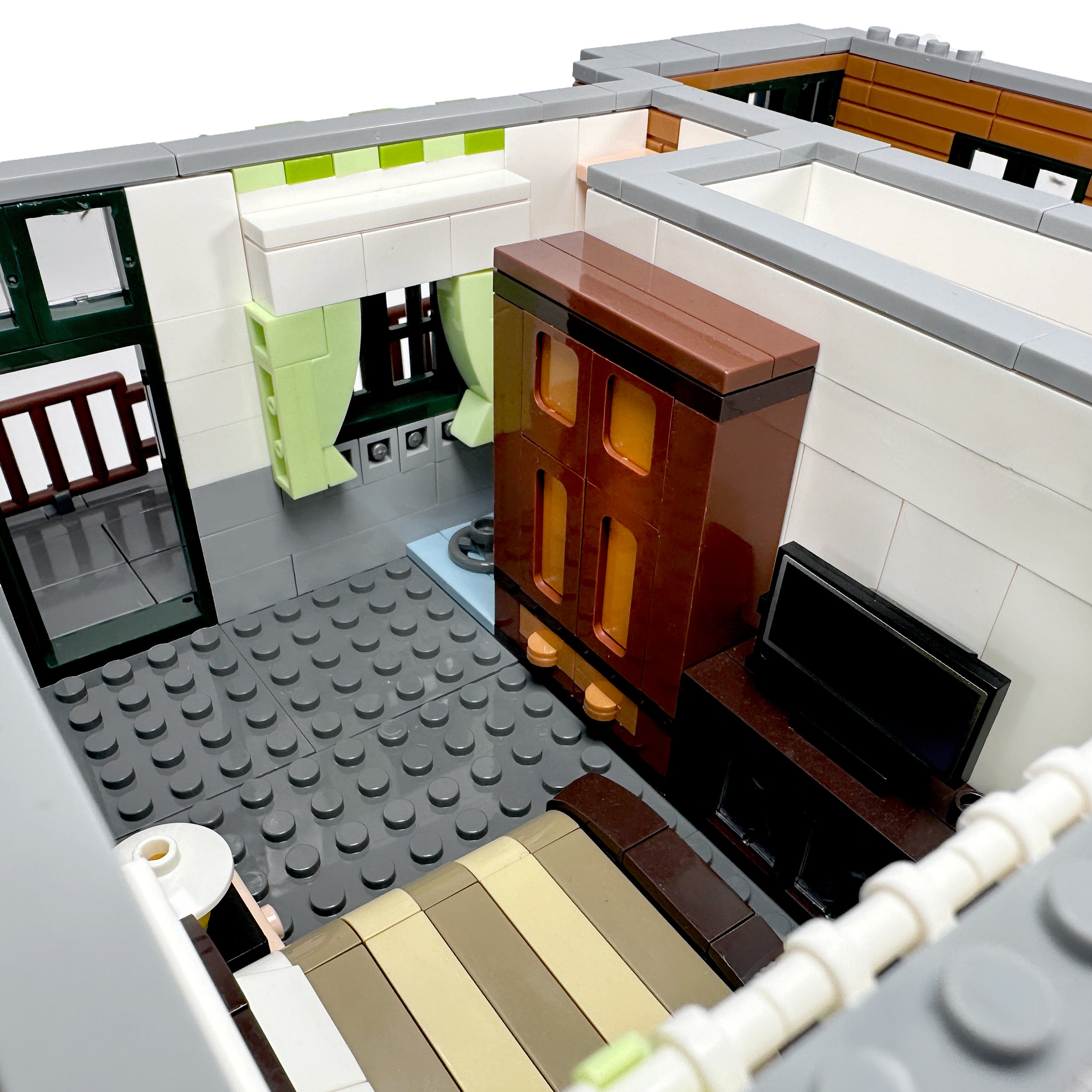 Interior view of second-floor bedroom featuring bed and small work area