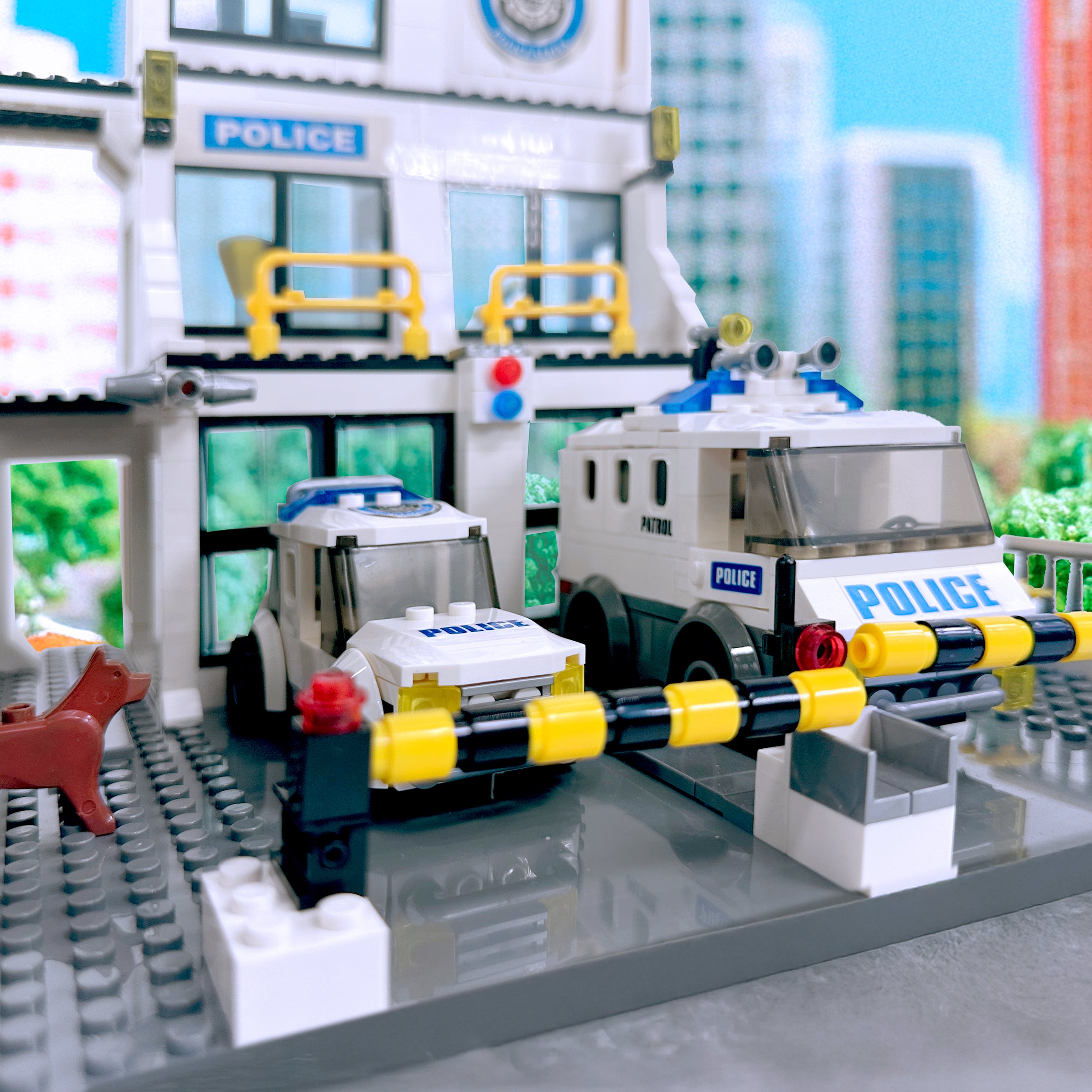 Detail close-up of police vehicles including transport truck, UTV, and paddy wagon
