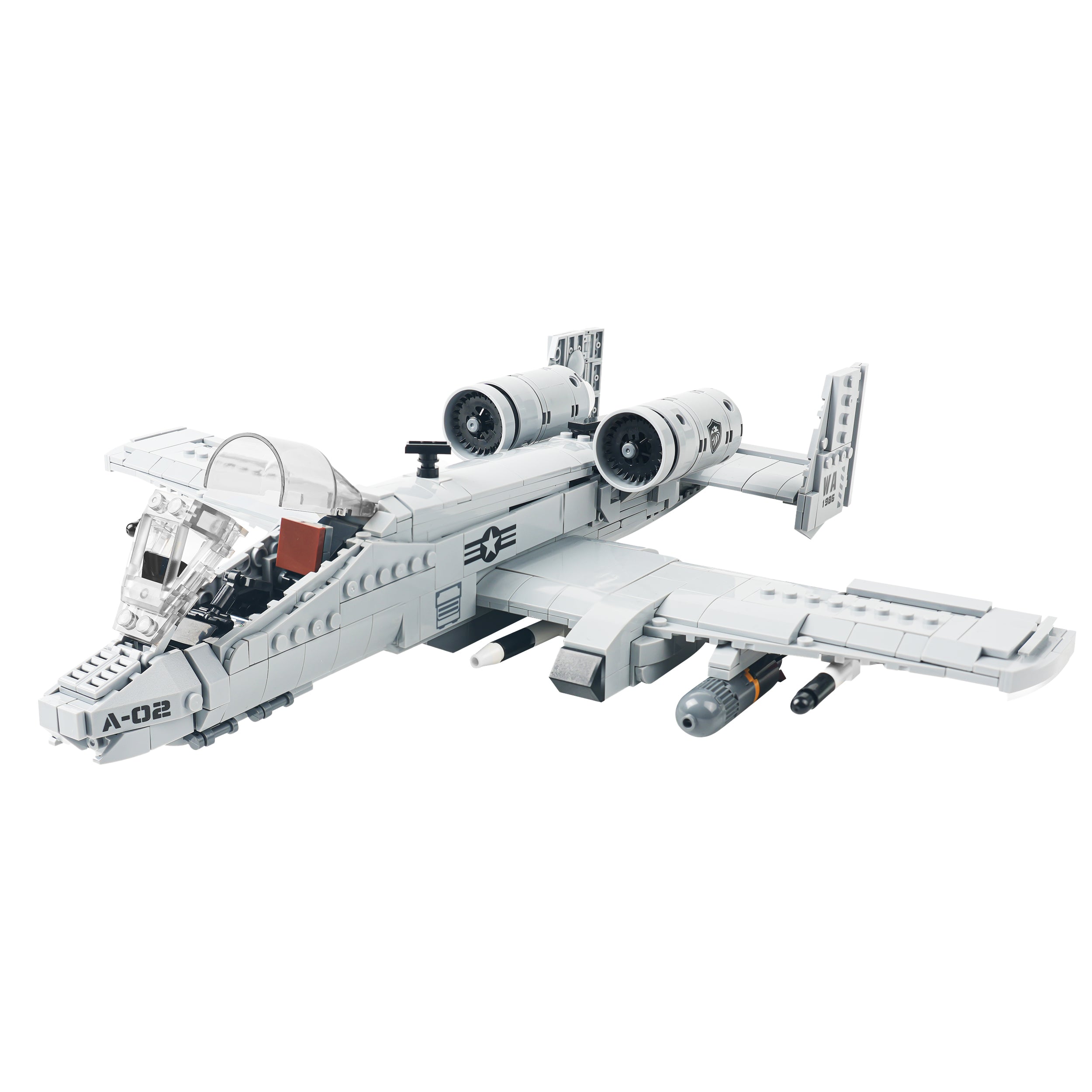 Left angle view of the brick-built A-10 aircraft showing artillery, twin engines and cockpit. 