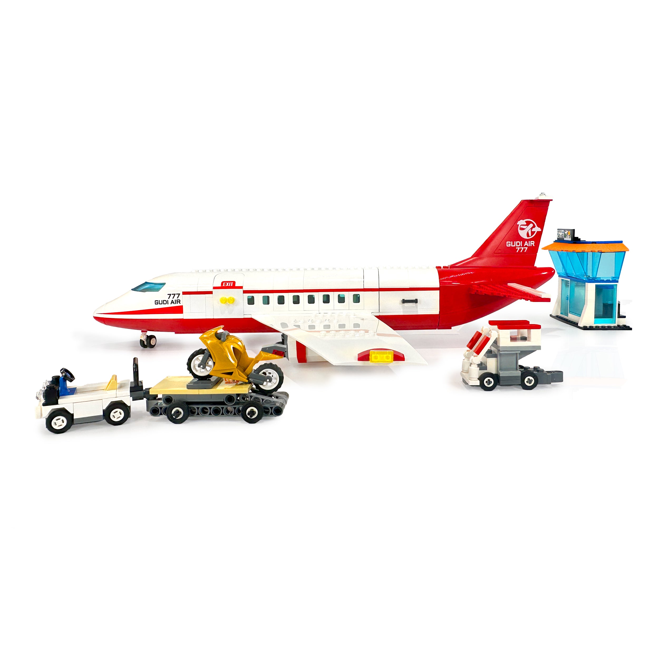 Left side view of commercial passenger plane with service vehicles and airport setup