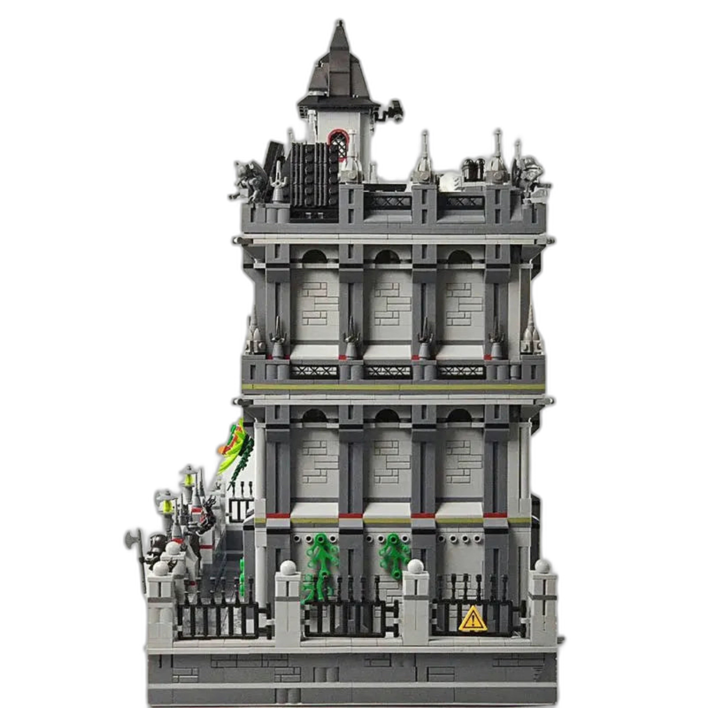 Side view of the asylum brick set showcasing its gray walls, barred windows, and detailed fence work.