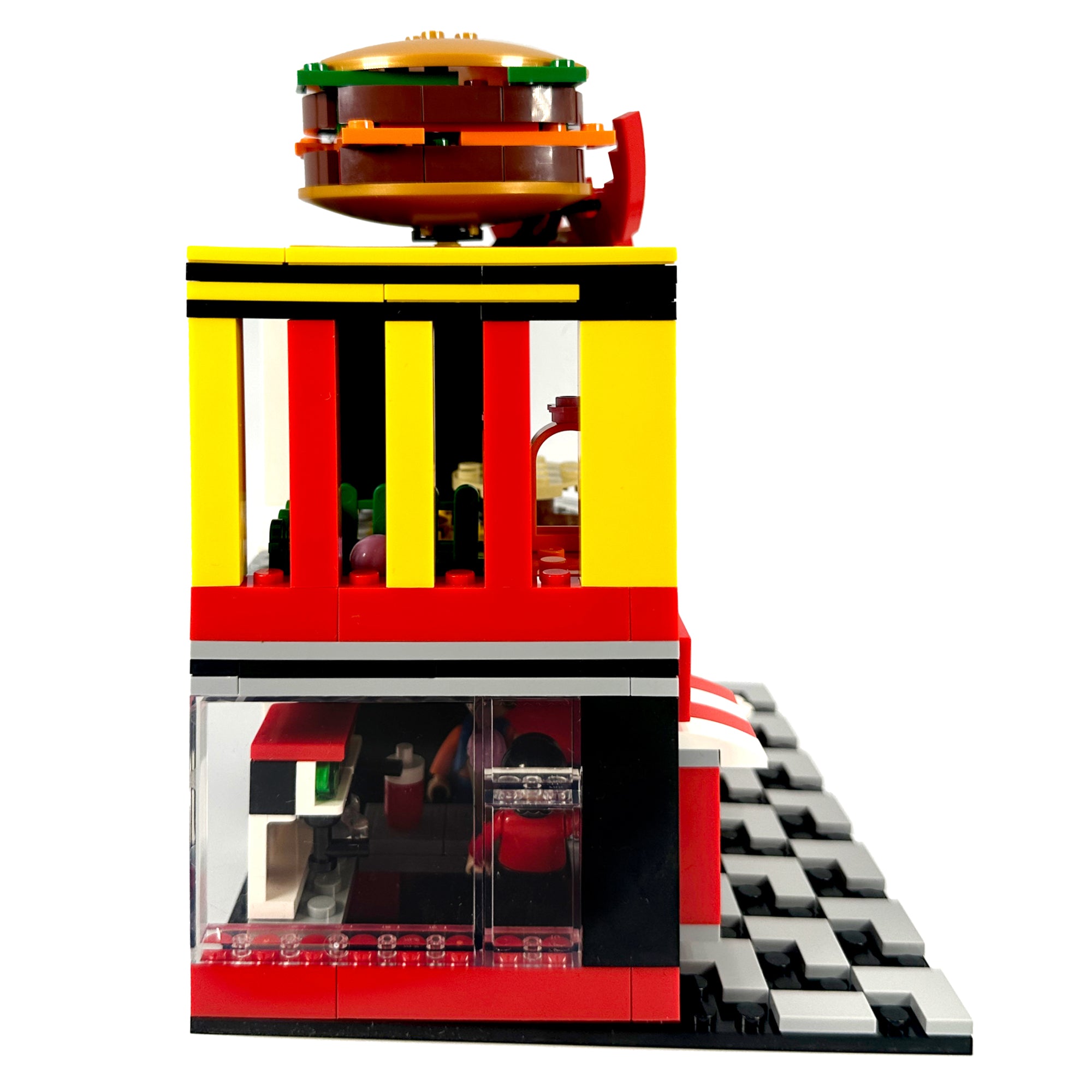 Right side view of modular burger restaurant featuring drive-thru window