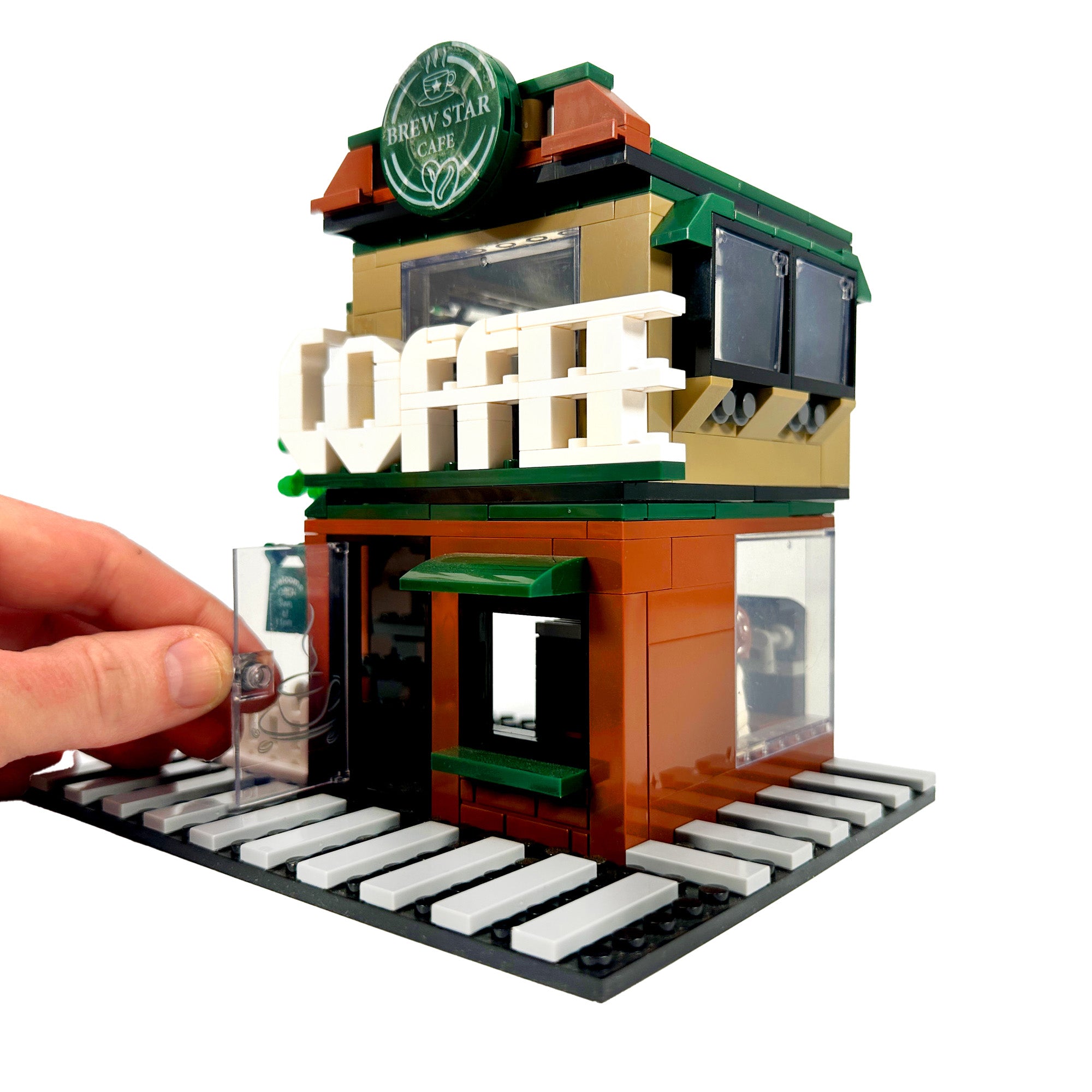 Walk-up service window and front entrance of Brew Star Café coffee shop model

