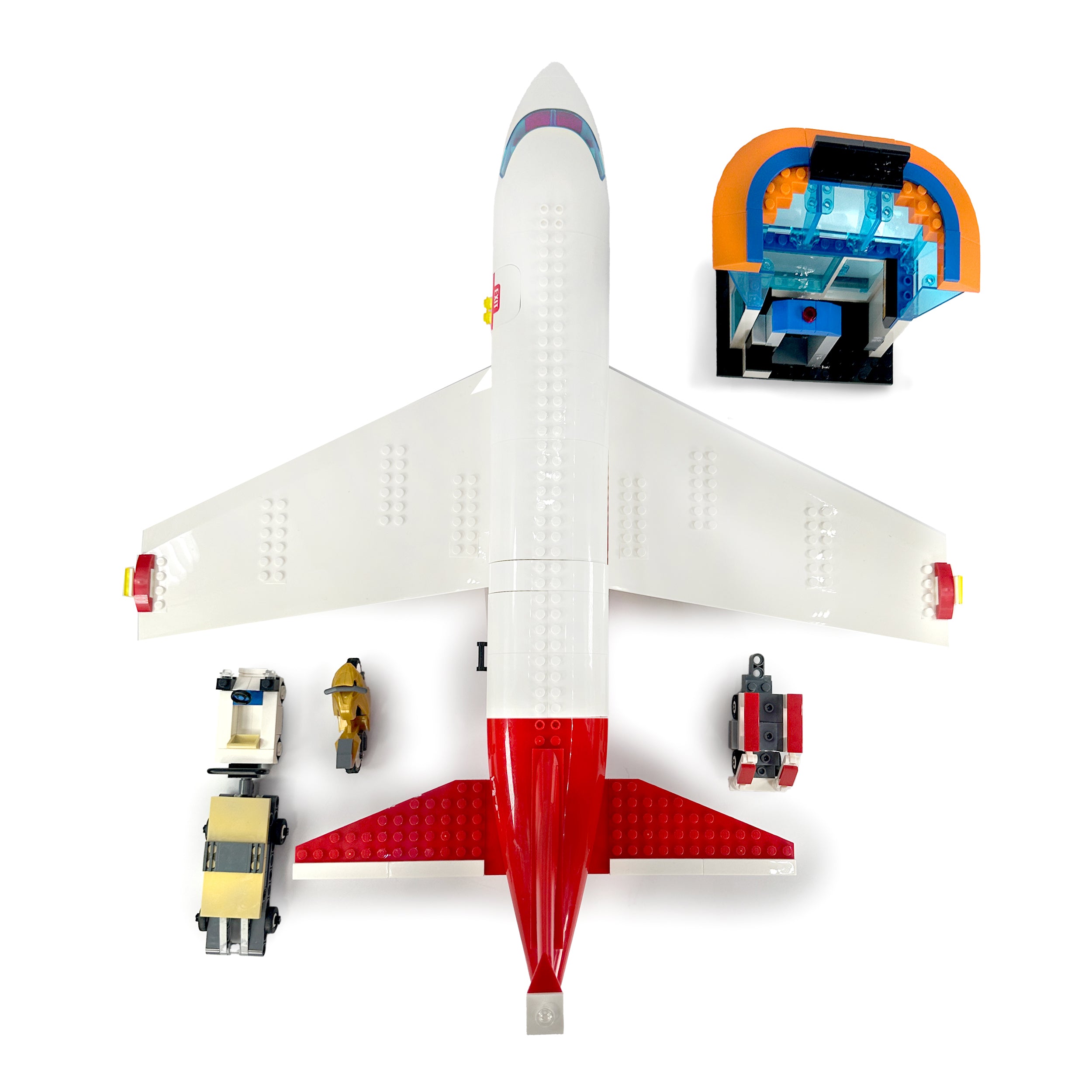 Top-down view of assembled passenger plane, service vehicles, and airport tower