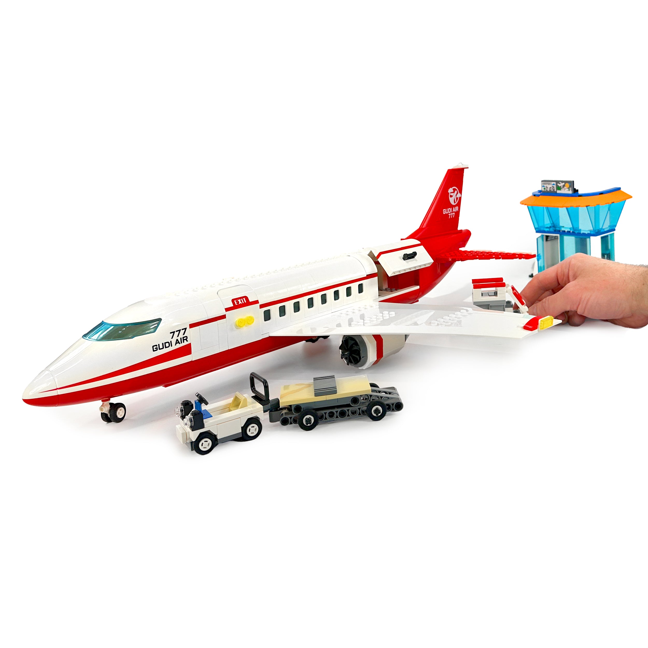 Passenger aircraft shown with hand for scale to illustrate model size
