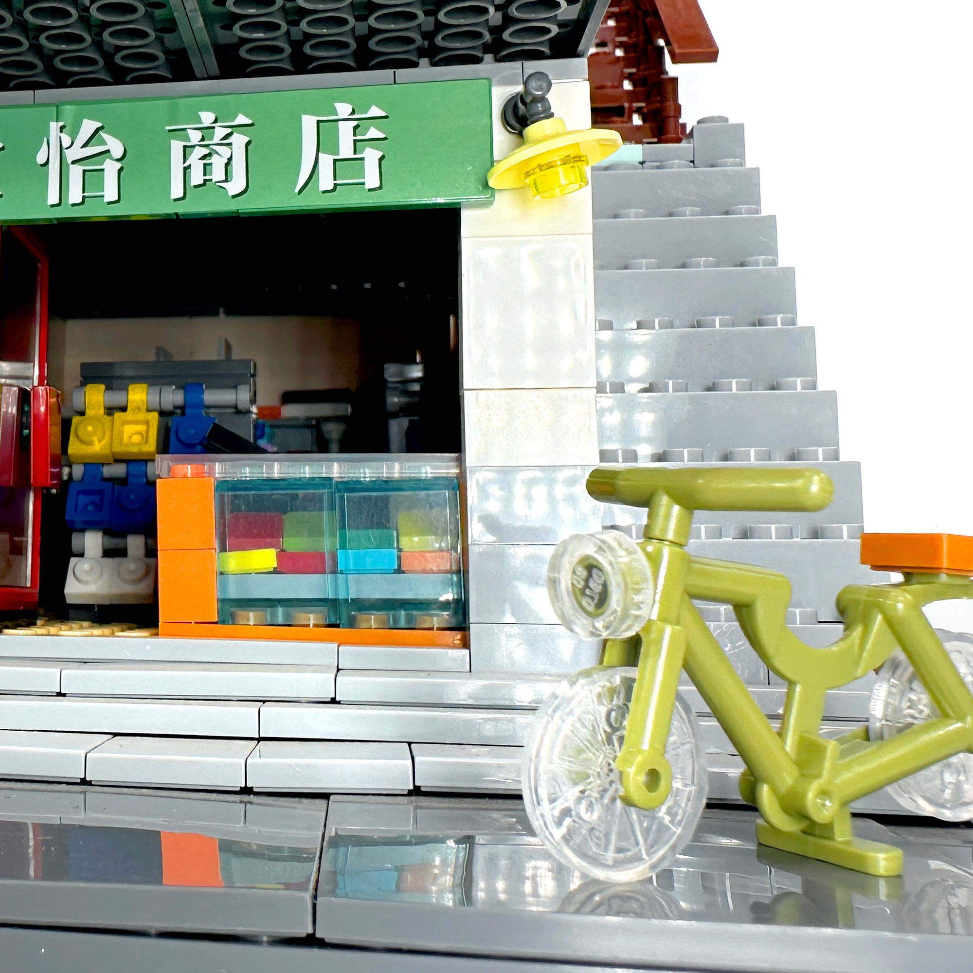 Front detail showing bicycle, dumpling shop display case, and entrance scene