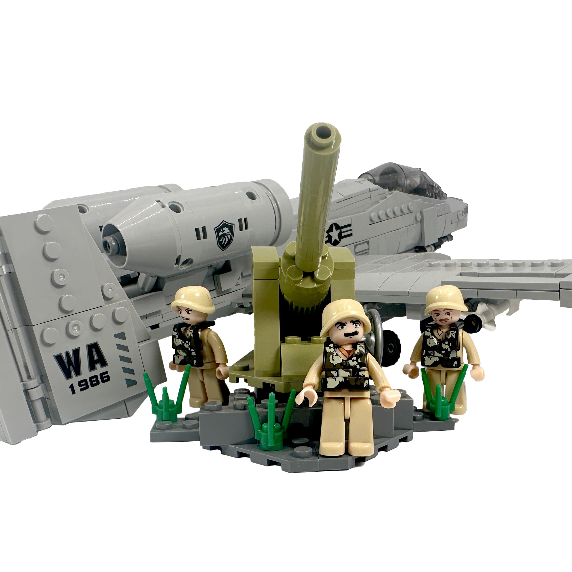 Three minifigurines in desert gear and a mounted cannon positioned in front of the Thunderbolt's tail fin. 
