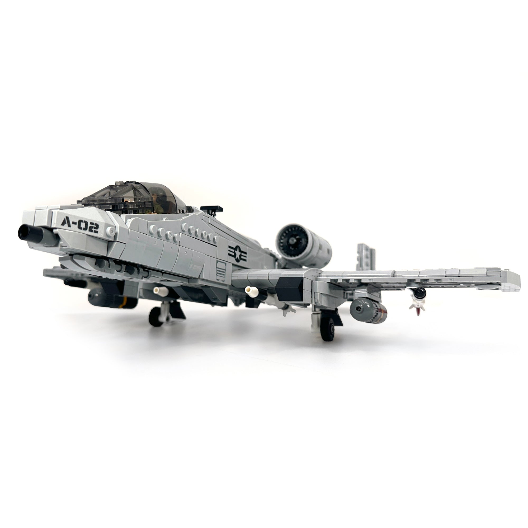 Detailed forward angle of model jet featuring dual landing gear and molded nose with printed markings. 