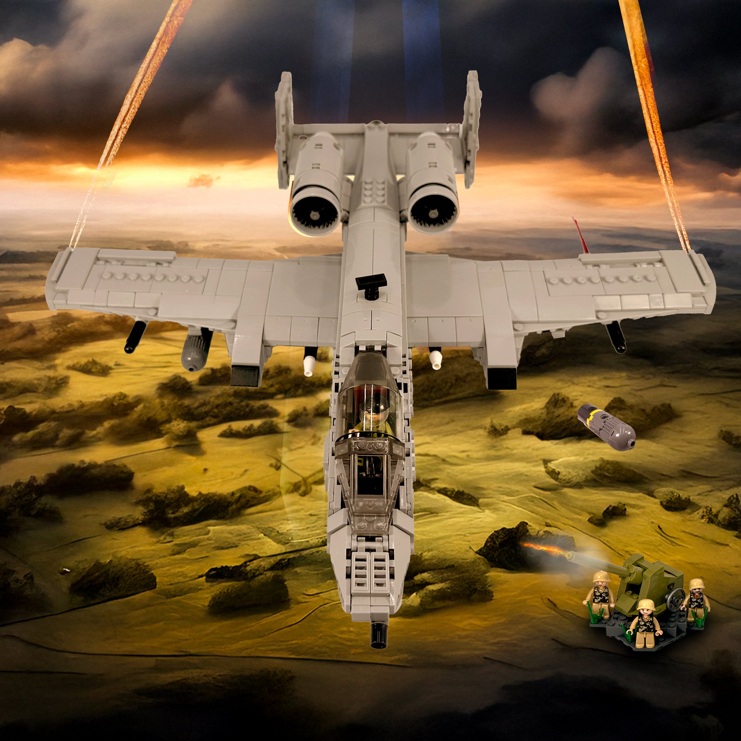 Diorama scene with A-10 flying over a battlefield backdrop, dropping payload near miniature soldiers. 