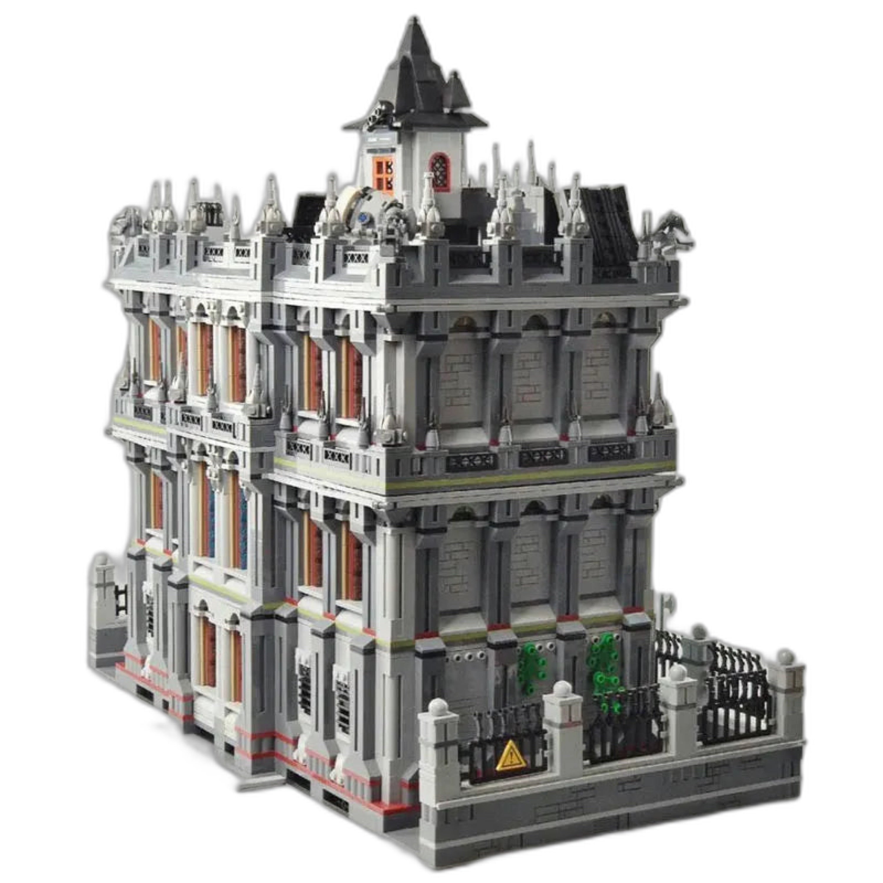 Three-level asylum built from interlocking bricks, featuring red windows, rooftop spires, and decorative details.