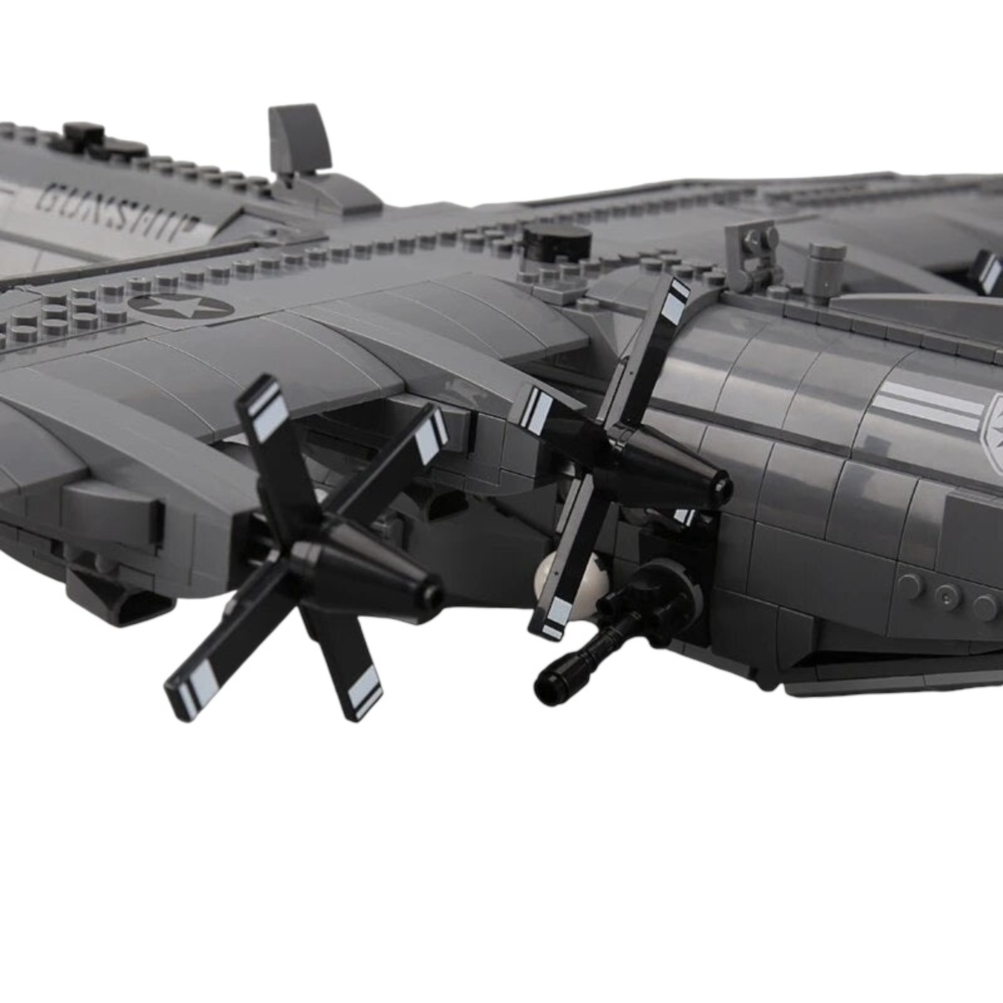 Close up of General Jim’s AC-130 Hercules Air Gunship Plane Building Blocks Set, focusing on two propellers and a side-mounted gun. 