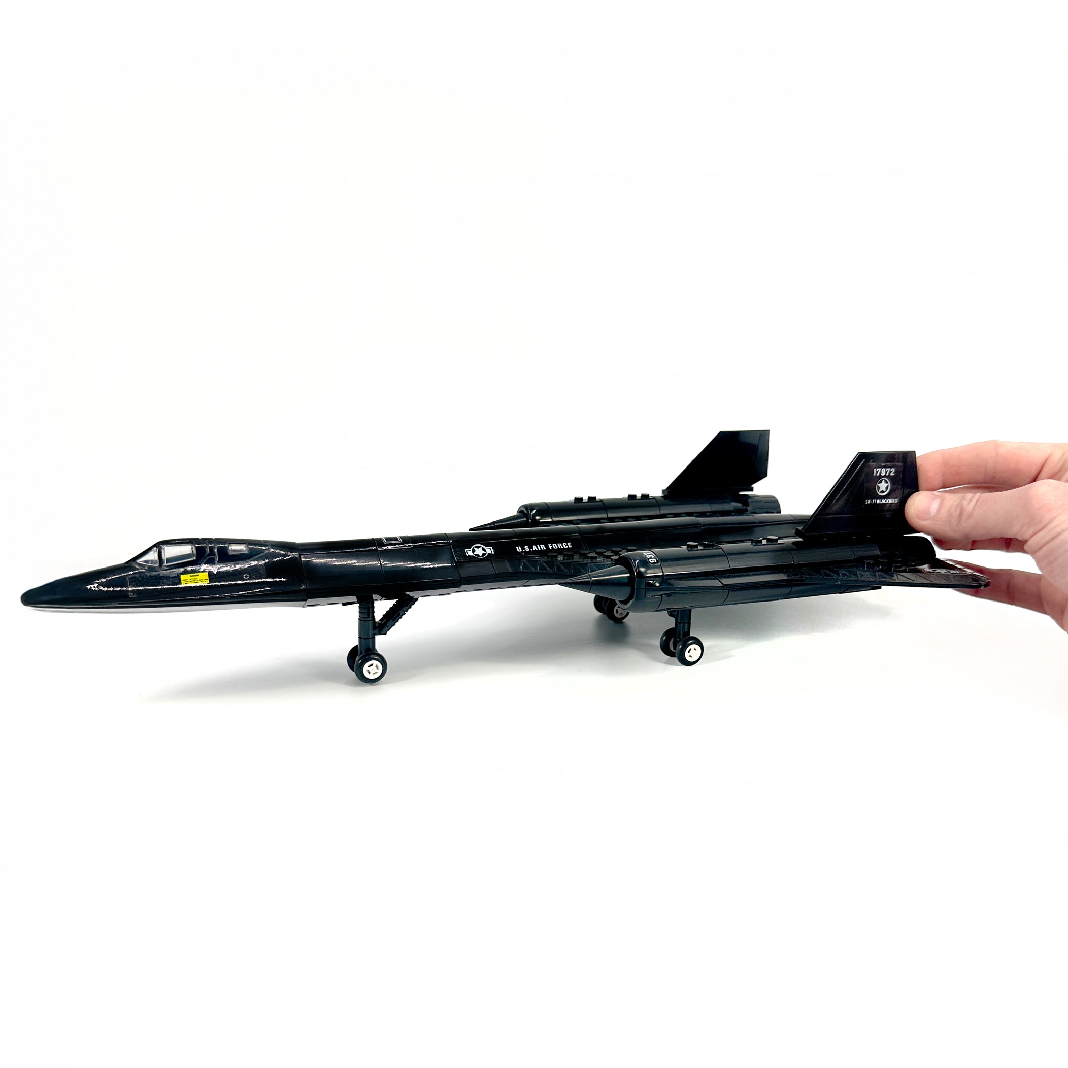 SR-71 Blackbird model shown with hand for scale comparison