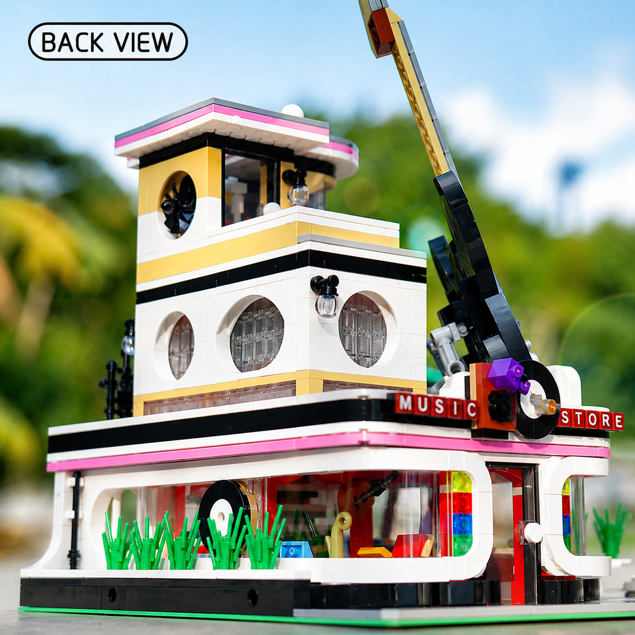 Back view of the music store street view set, showing architectural details compatible with LEGO city street layouts.